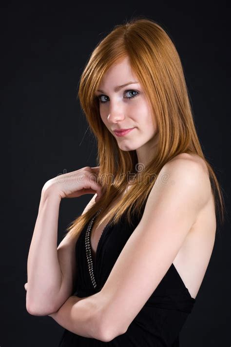 Portrait Of A Shy Redhead Girl In Black Dress Royalty Free
