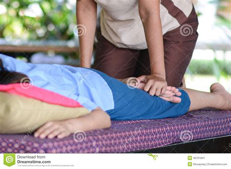 girl is relaxing from massage by professional therapists stock image