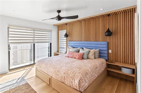 wood accent wall adds warmth   bedroom
