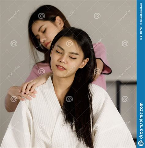 asian women black long hair masseuse with pink suite to massage