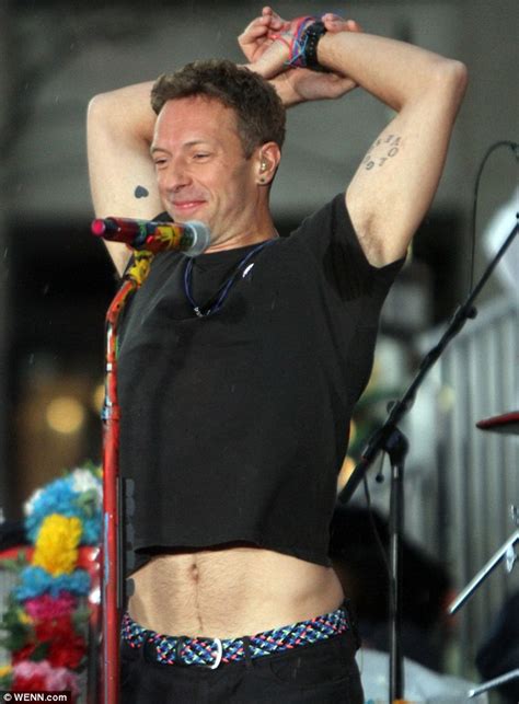 Chris Martin Flashes Sculpted Stomach During Coldplay Performance In