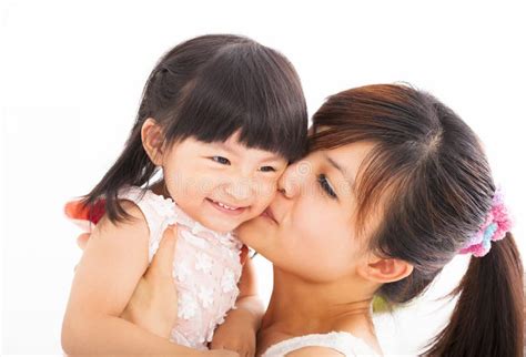happy mother kissing her daughter stock image image of asian girl
