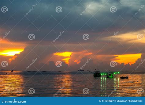 colorful flame cloud sunset fisging boat  sea  sky stock image