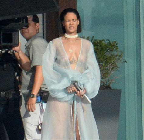 why was rihanna walking around almost naked with a gun in miami the source