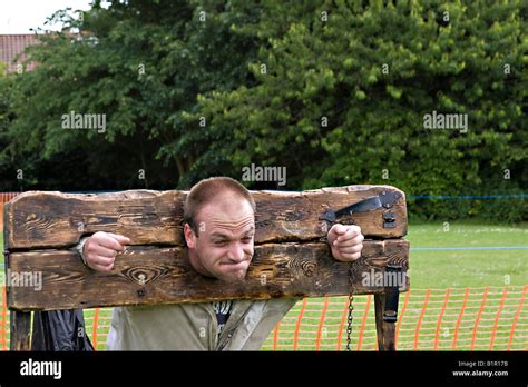 man  wooden stocks uk stock photo alamy