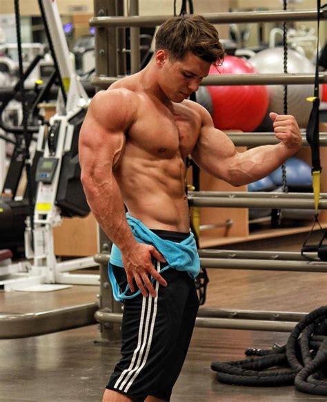 huge strong shirtless muscle hunk flexing biceps swole gym bro young beefcake