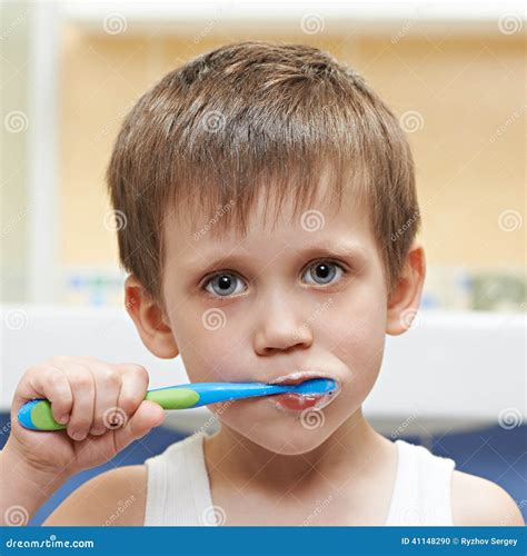 boy brushing  teeth stock photo image  foam brushing