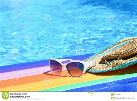 sunglasses lilo and hat on the water in hot sunny day