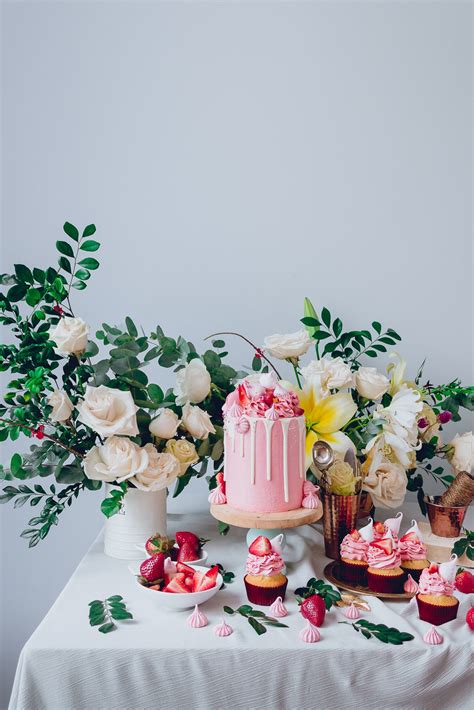 White Cake With Pink Frosting And Strawberry Meringue Kisses