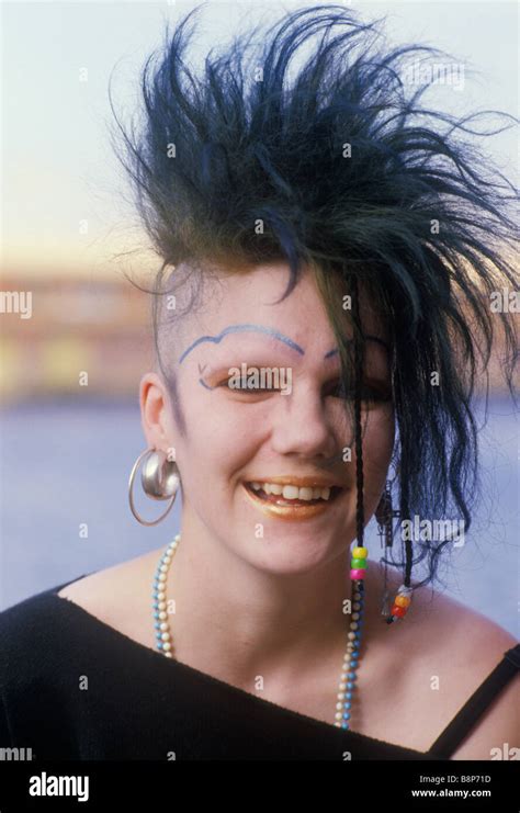 punk teen girl with half shaved head and unusual black eye