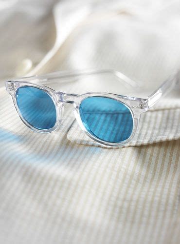 semi round sunglasses in clear with blue lenses blue sunglasses