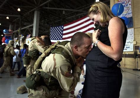 capt tory burgess of the us army s 4th brigade kissed his wife soldier homecoming kissing