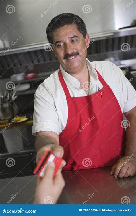 man receiving payment  restaurant stock photo image  male indoors