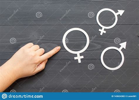 The Women Points His Hand To The Symbol Of Gender Equality