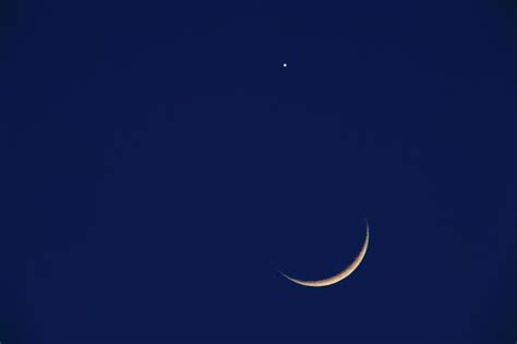 crescent moon in night sky photograph by imagewerks