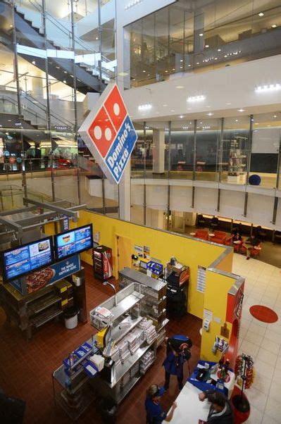 dominos pizza reports rise  profits