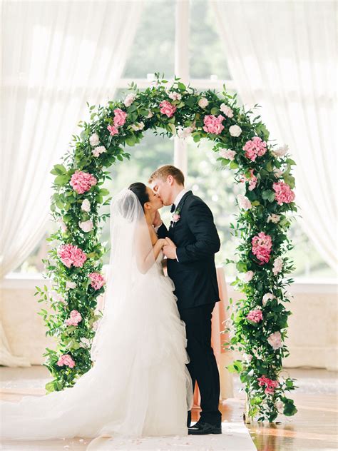 wedding arch  greenery  pink hydrangeas