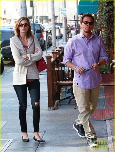 full sized photo of mark wahlberg holds hands with wife rhea durham 01