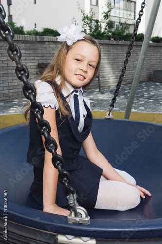 Cute Elementary Schoolgirl In Uniform At Playground Schoolgirl In A