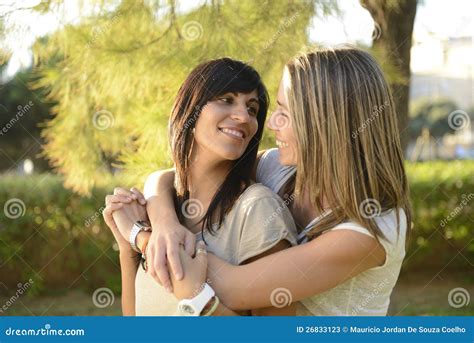 Lesbian Couple Lifestyle Surprising With Bouquet Stock Image