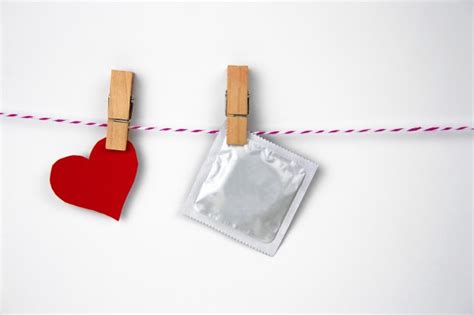 Condom In Male Hand And Female Hand Give Condom Safe Sex