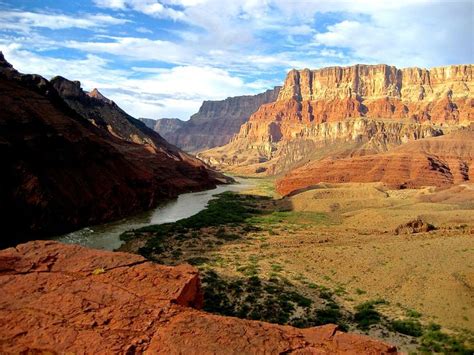 the colorado river winding through the breathtaking grand canyon