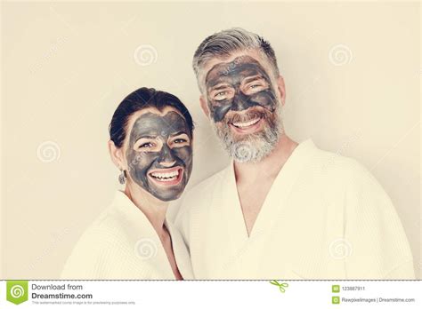 Happy Couple Wearing A Charcoal Mask Stock Image Image