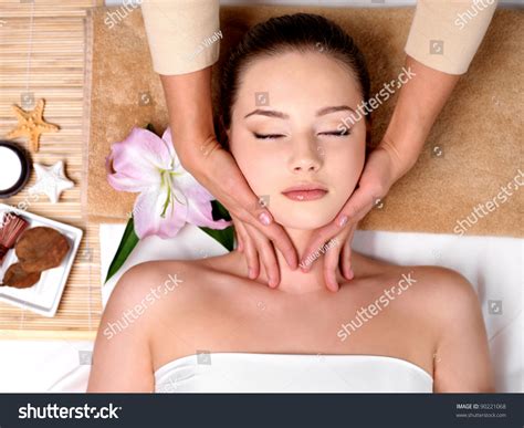 Beautiful Young Girl Getting Massage For Neck In Spa Salon Indoors