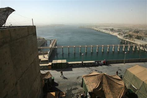 launches  airstrikes  isis  protect dam  iraq   york times