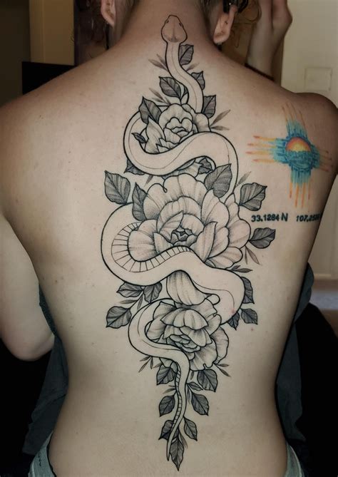 spine tattoo  tattoo  snake wrapped  flowers