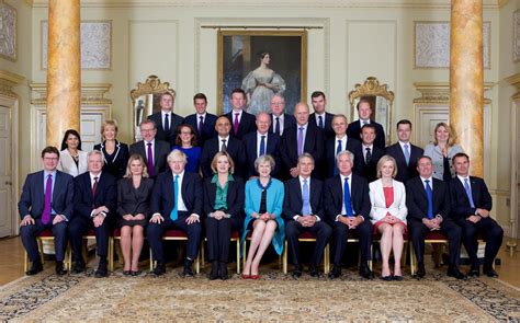 the cabinet photo where there are more purple ties than non white faces