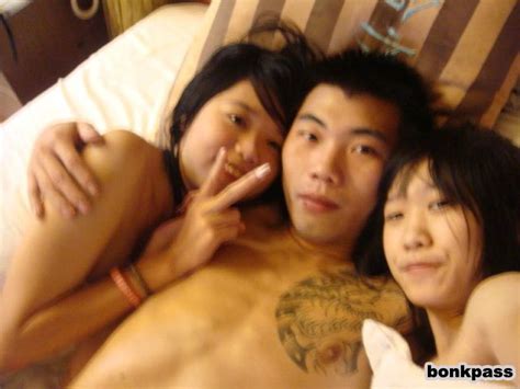gangster looking guy with two naked chinese girls asian porn times