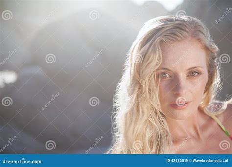 Gorgeous Blonde In Floral Bikini Posing On The Beach Stock Image