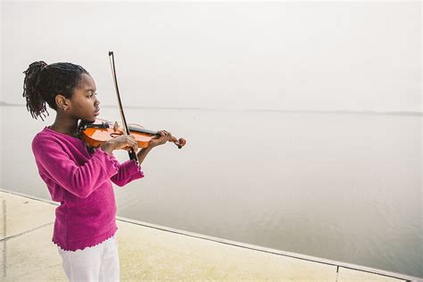 black girl with violin stocksy united