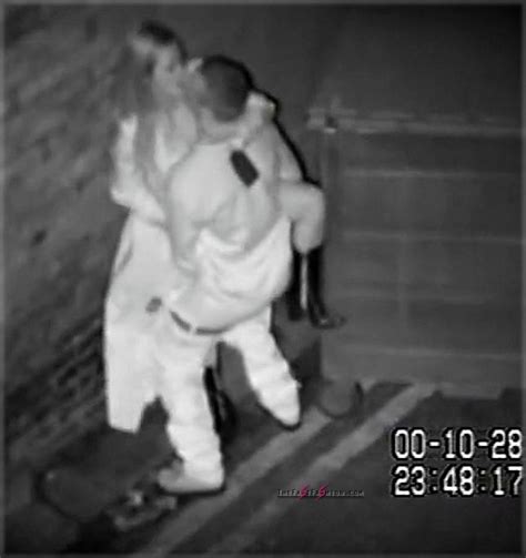 unsuspecting couples caught romping on cctv in dingy passage behind