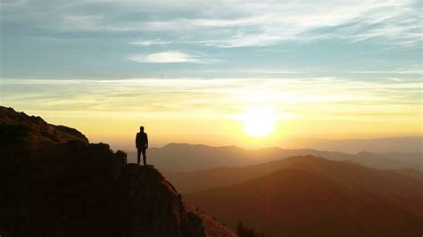 male standing   mountain  enjoying  beautiful sunset stock video footage