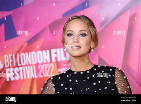 Jennifer Lawrence Poses For Photographers Upon Arrival For The Premiere