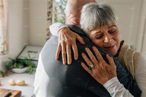 senior couple hugging   high quality people images