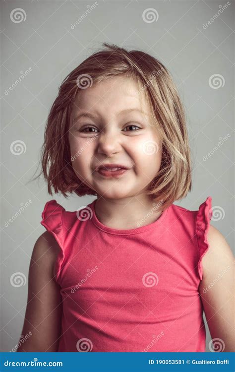 blond caucasian  girl making  ugly  funny face stock image