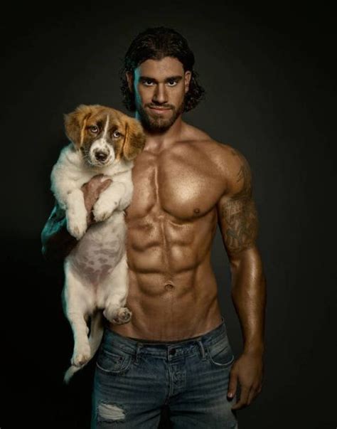 wonderful   hot guys holding cute dogs
