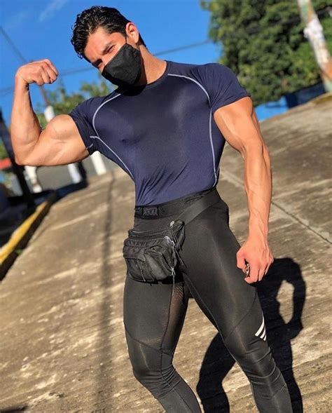 sexy muscular dude huge biceps flex face mask hunk