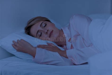 Beautiful Mature Woman Sleeping Well On The Side At Night Stock Image