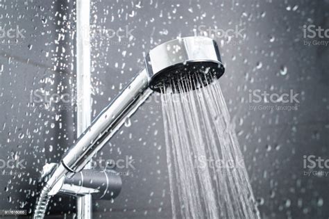 fresh shower behind wet glass window with water drops splashing stock