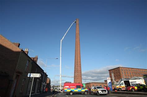 flipboard police say no signs of life from man stuck at top of 290ft chimney in carlisle