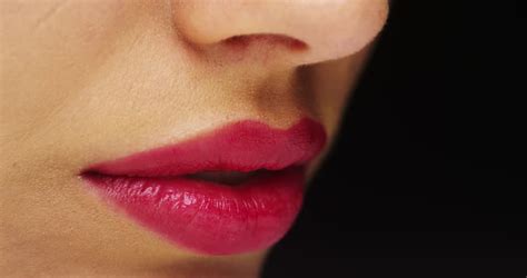 woman applying pink lip gloss close up stock footage video 1106002 shutterstock