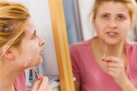 woman removing peel off mask from her face stock image image of