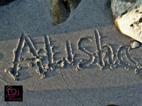 yajeeb photography and news writing name in river beach sand