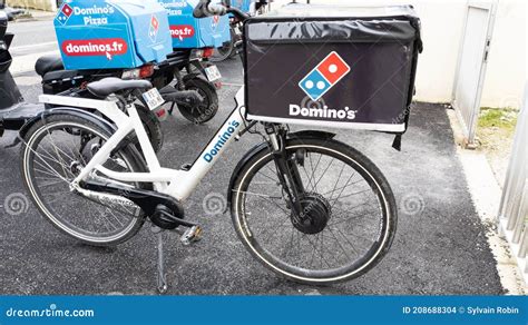 dominos pizza bicycle  text sign  restaurant dominos  pizza chain  editorial stock
