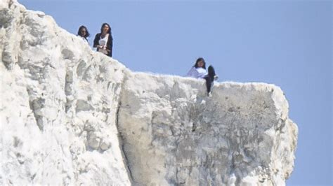 Tourists Pictured Risking Their Lives As They Stand On A Cliff Edge To