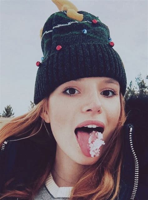 bella thorne says she s a hot mess as she eats snow then rolls around